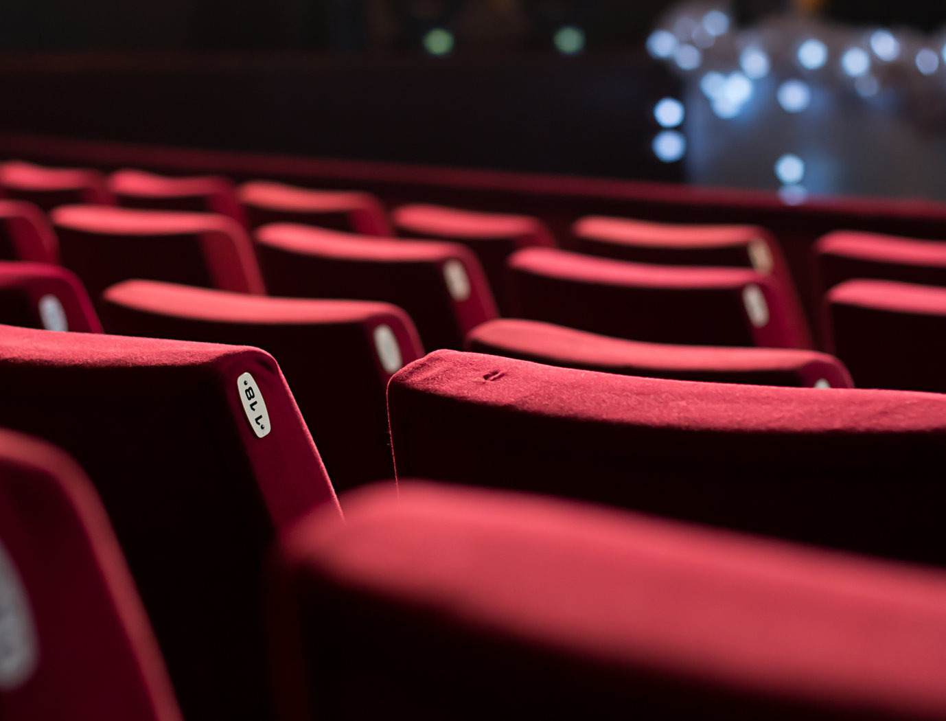 Rows of red theater seats