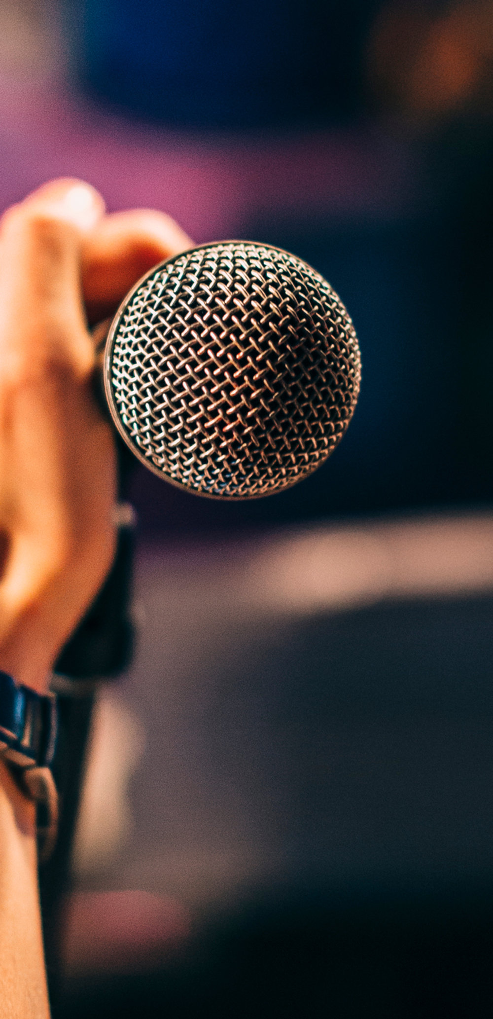 Hand holding a microphone